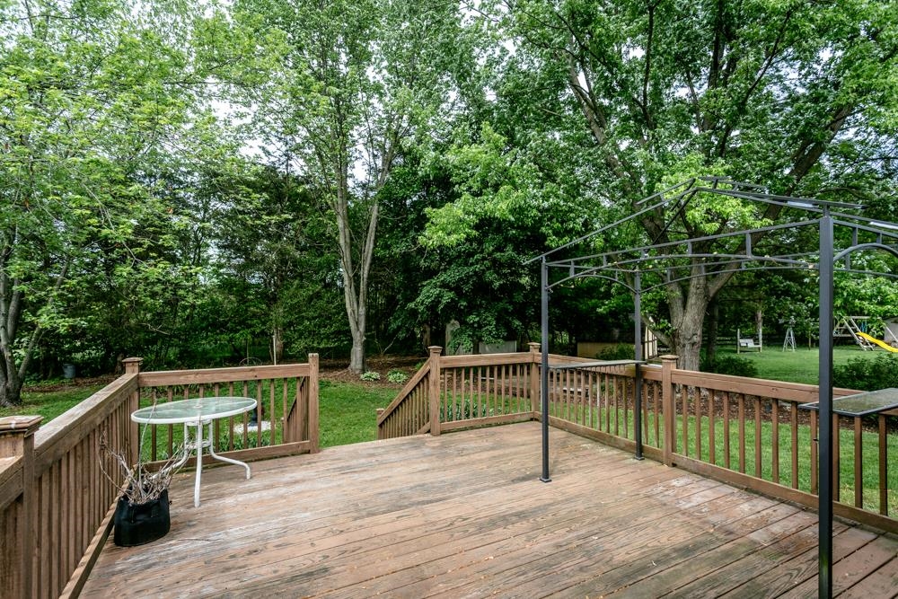 87 Bluestone Drive Weyers Cave, VA 24486 - Photo 32 of 37 a view of a deck with two chair and wooden floor