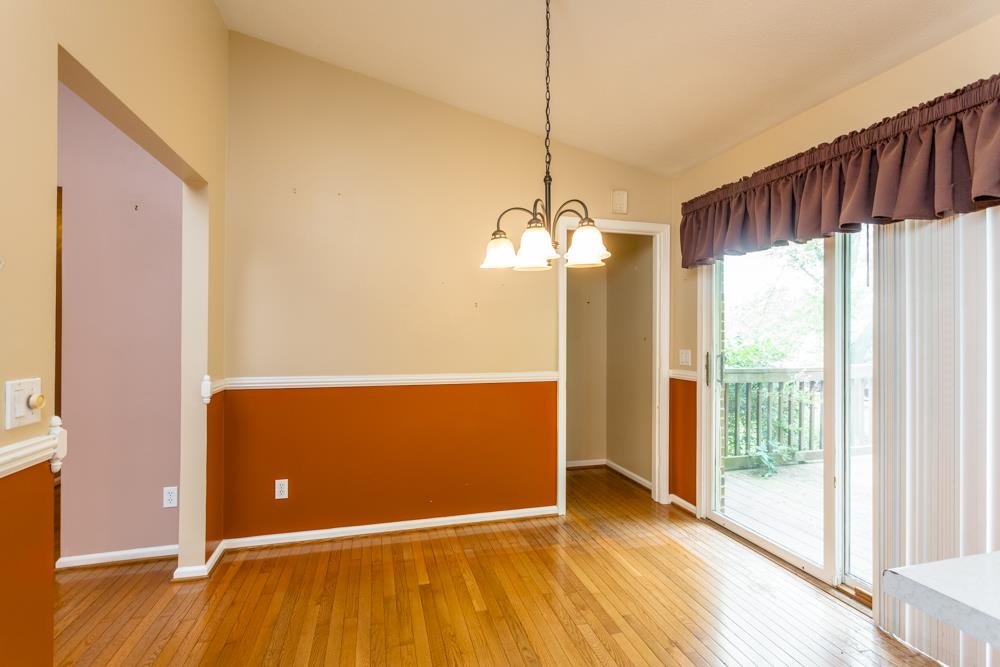 87 Bluestone Drive Weyers Cave, VA 24486 - Photo 5 of 37 a view of a livingroom with wooden floor staircase and a kitchen space