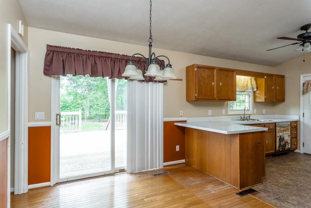 87 Bluestone Drive Weyers Cave, VA 24486 - Photo 7 of 37 a kitchen with stainless steel appliances granite countertop a stove a sink dishwasher and a refrigerator