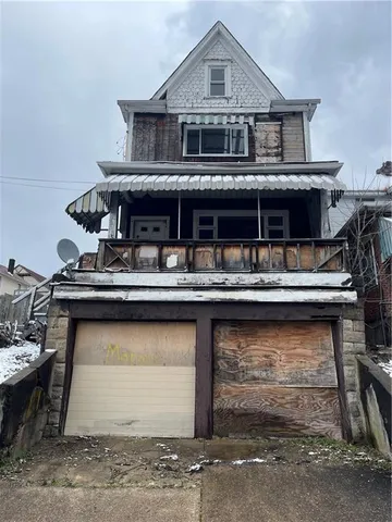 a front view of a house with balcony