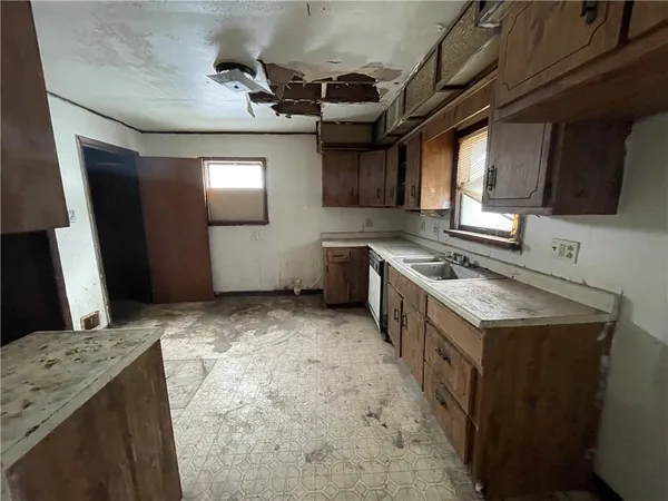 a kitchen with a stove and a refrigerator