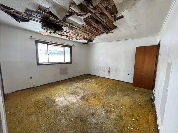 a view of empty room with windows