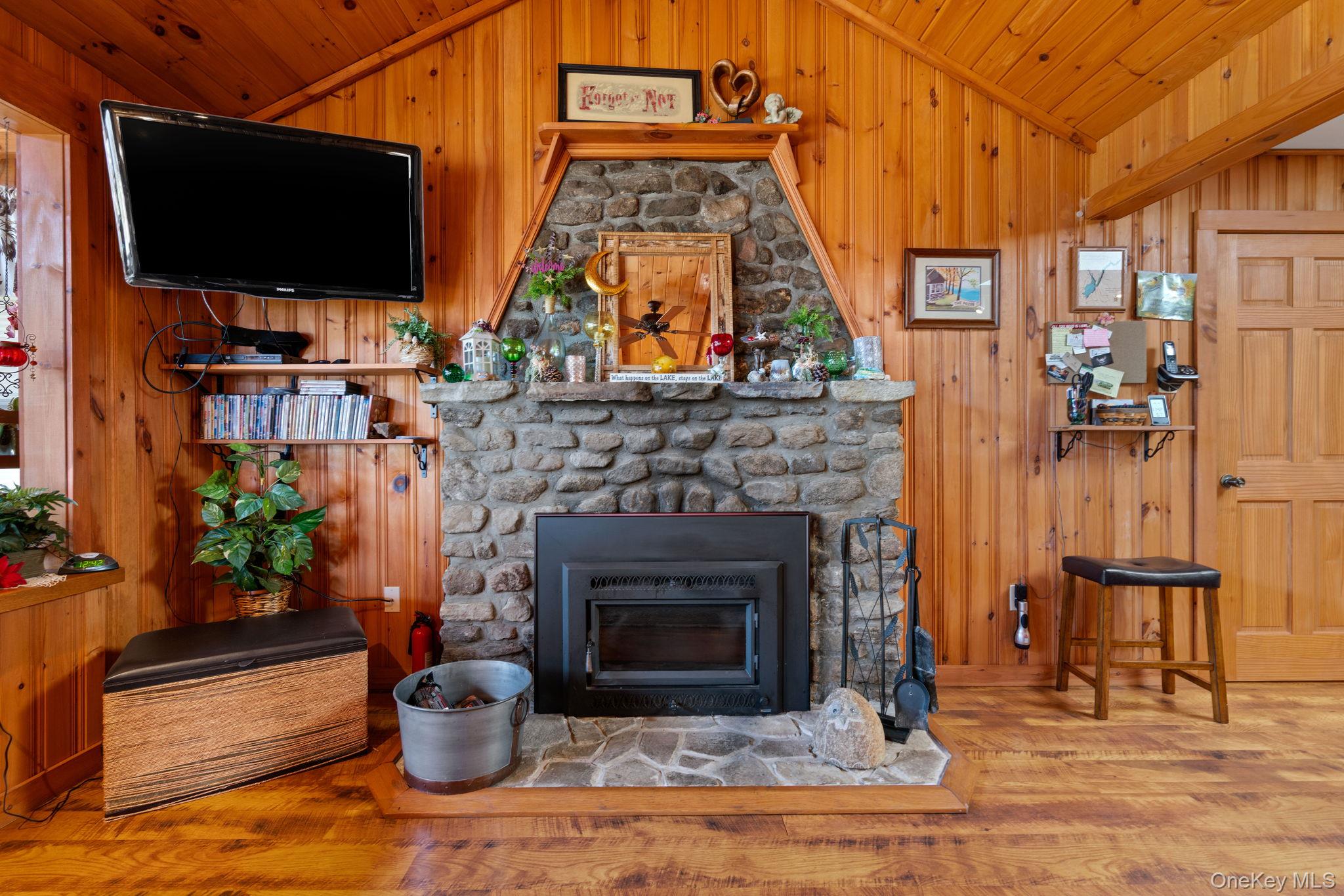 866 North Shore Road Hadley, NY 12835 - Photo 24 of 50 The cornerstone of the living room, a cozy wood burning fireplace.