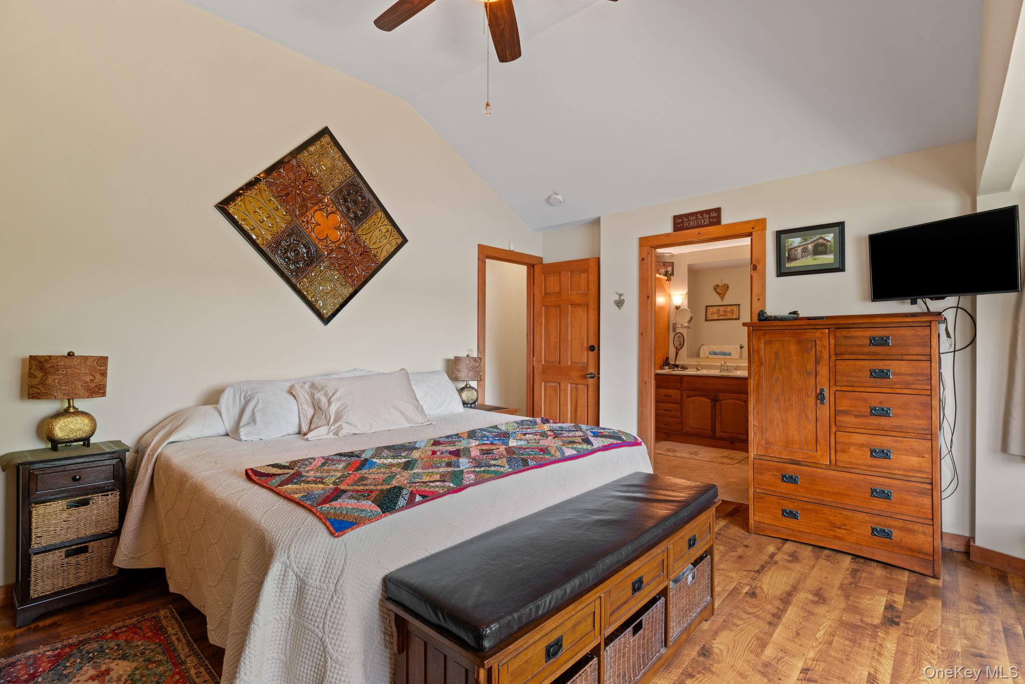 866 North Shore Road Hadley, NY 12835 - Photo 33 of 50 Primary bedroom provides storage and vaulted ceiling.