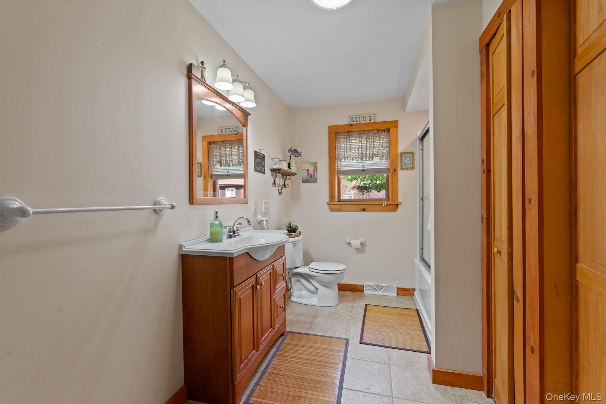 866 North Shore Road Hadley, NY 12835 - Photo 37 of 50 Full guest bath with ample storage as well as in closet, full washer/dryer.