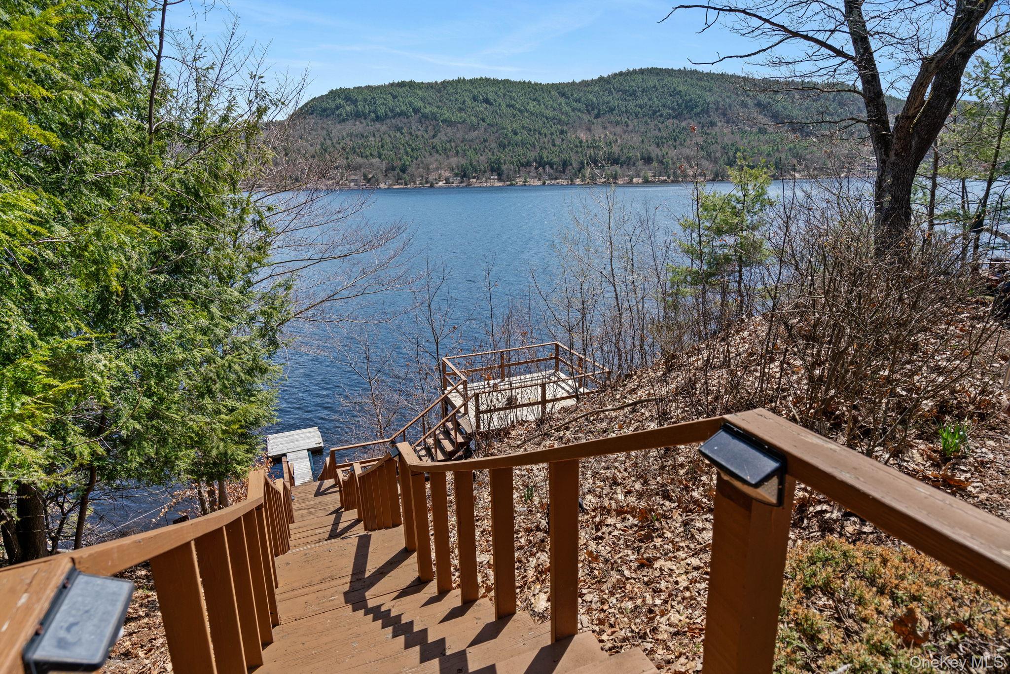 866 North Shore Road Hadley, NY 12835 - Photo 47 of 50 Step down to your own dock as well as additional entertainment deck.