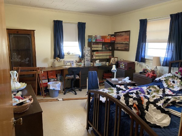 66 Union Hill Road Loretto, TN 38469 - Photo 25 of 31 a bedroom with a bed a standing dresser and a window