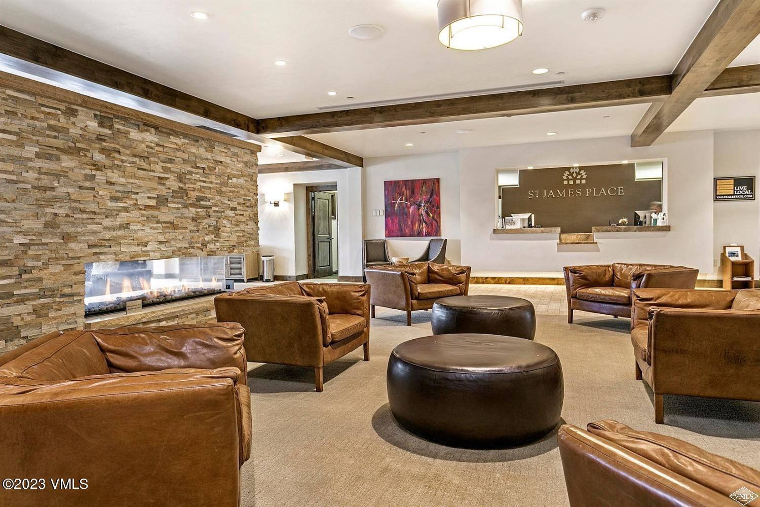 210 Offerson Road, Unit 10937 38 Beaver Creek, CO 81620 - Photo 8 of 9 a living room with furniture and a flat screen tv