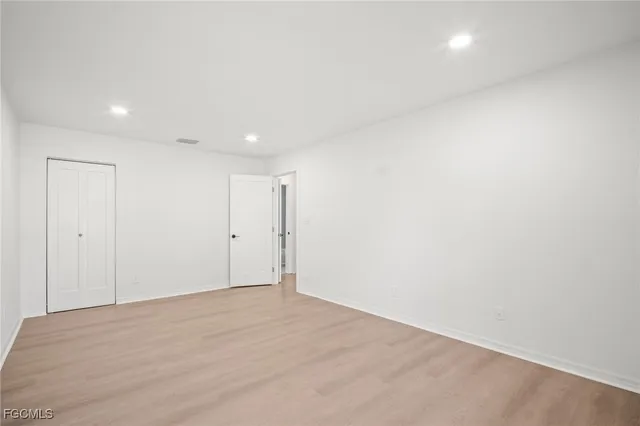 a front view of a house with garden and porch