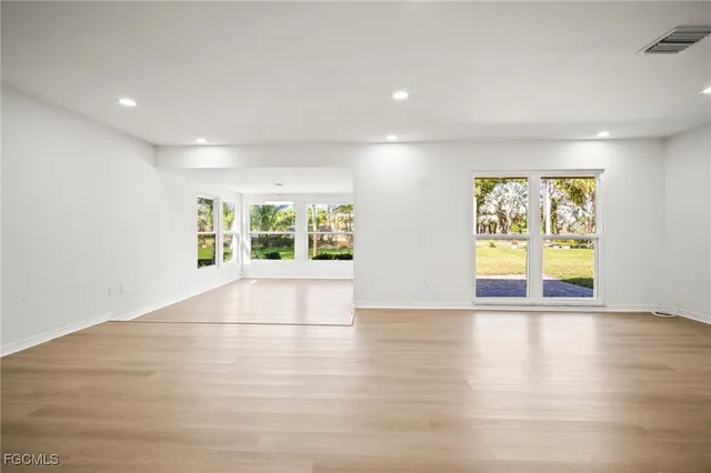 a kitchen with stainless steel appliances white cabinets and stove top oven