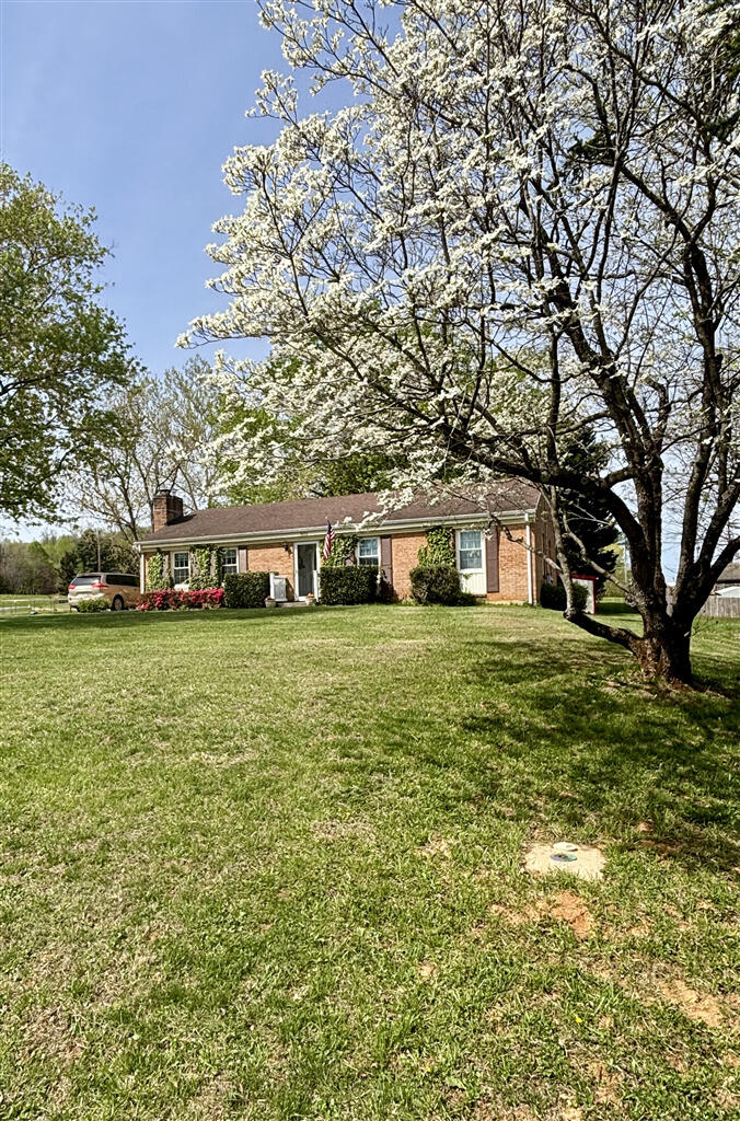 1032 Windy Ridge Drive Bedford, VA 24523 - Photo 2 of 27 a front view of a house with a yard