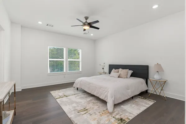 a bedroom with a bed and window