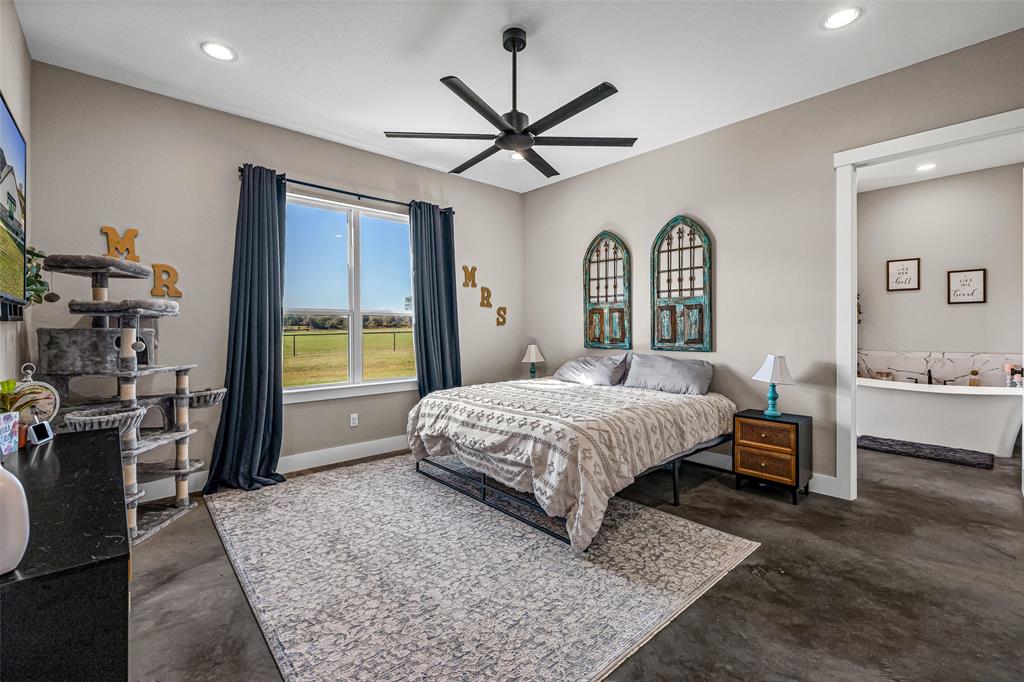 310 Runyan Rnch Road Tolar, TX 76476 - Photo 34 of 35 Bedroom with finished concrete flooring, recessed lighting, and ceiling fan