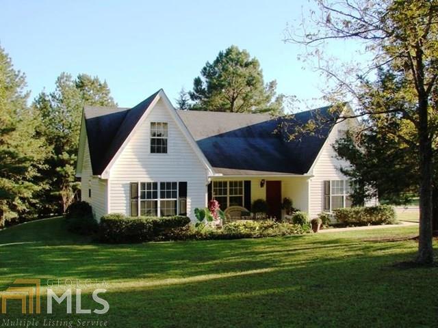 3931 Jeff Davis Road, Unit 2 Thomaston, GA 30286 - Photo 1 of 1 a front view of a house with a yard table and chairs