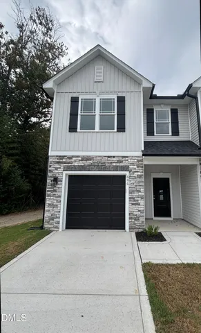 a front view of a house with yard