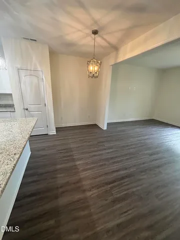 a view of a livingroom with wooden floor