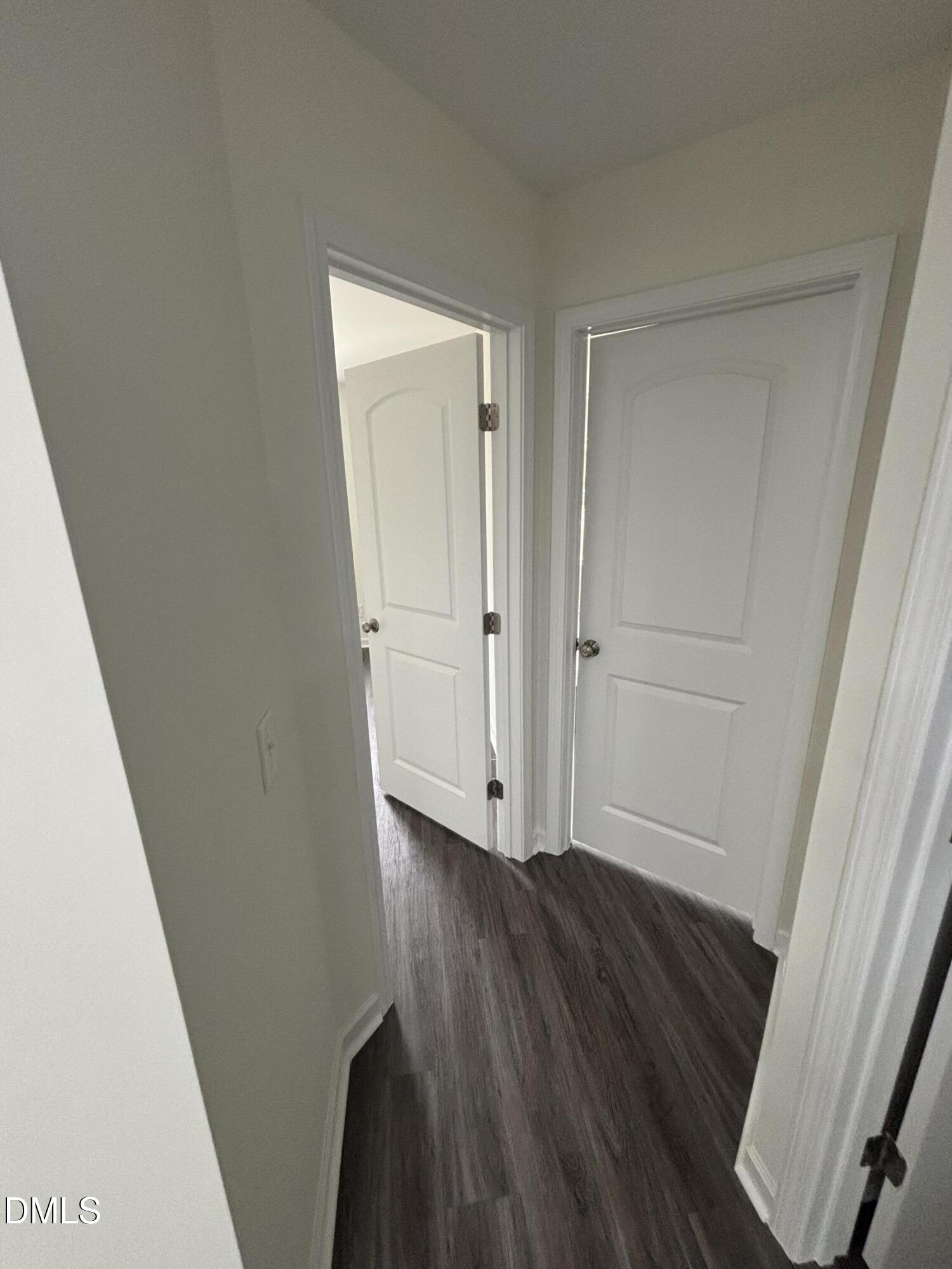 606 South Blackmon Street Benson, NC 27504 - Photo 24 of 25 a view of an empty room with wooden floor and a window