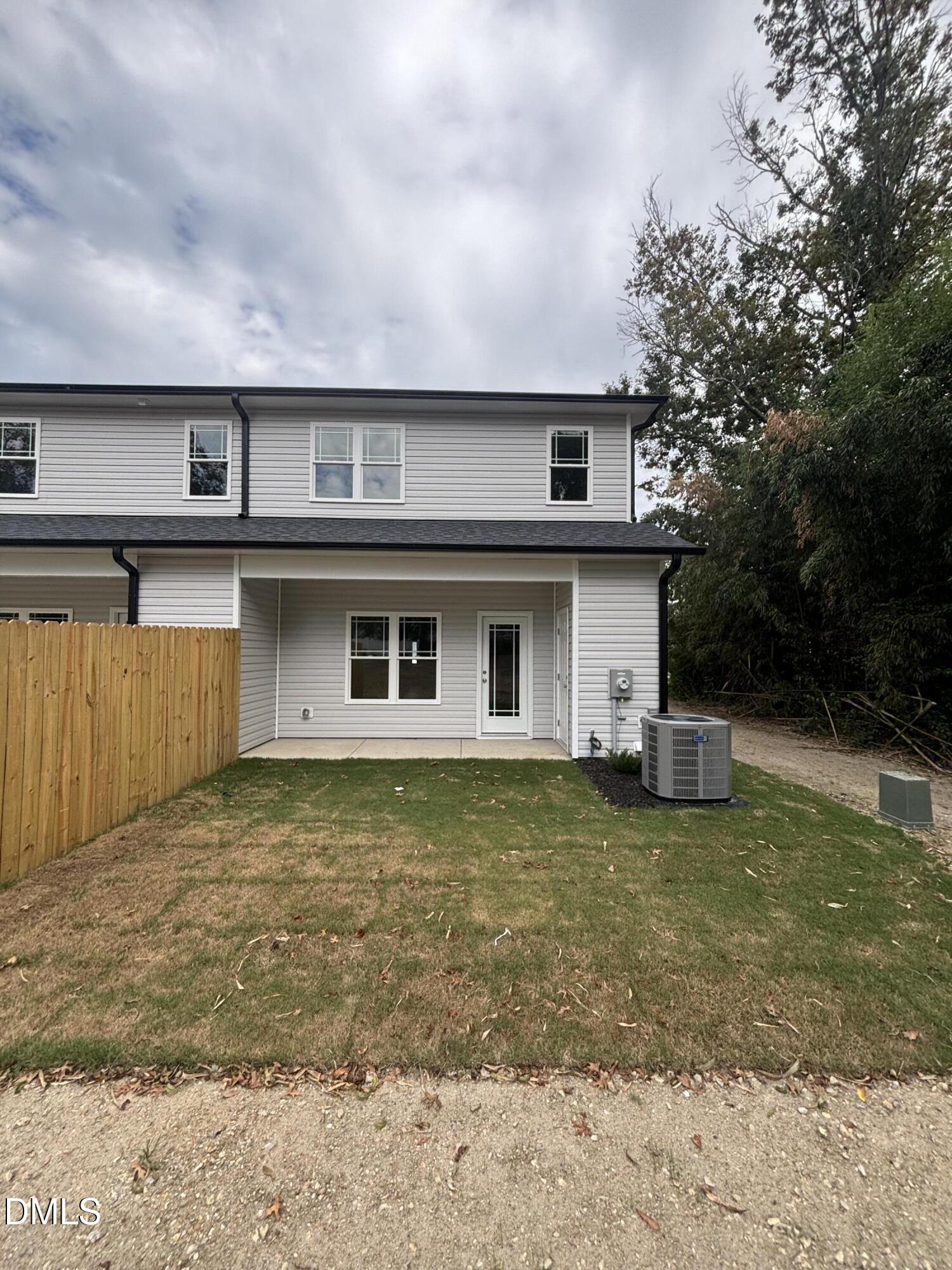 606 South Blackmon Street Benson, NC 27504 - Photo 25 of 25 a front view of a house with a yard