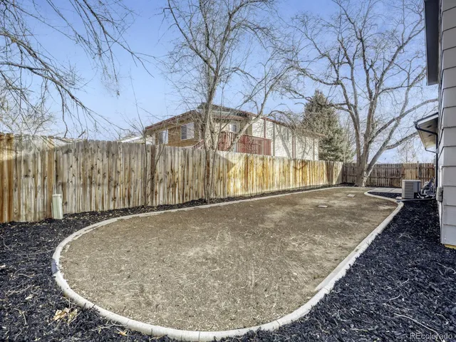 a view of outdoor space with wooden fence