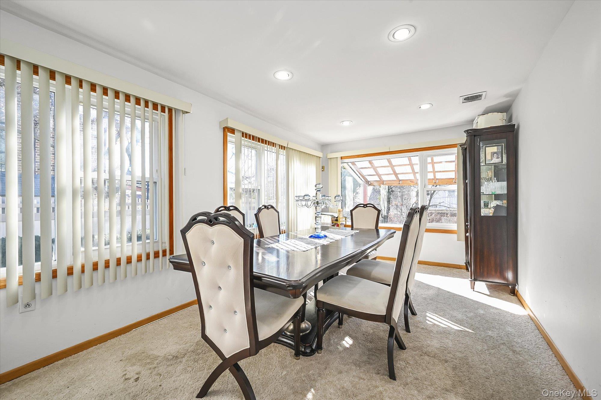 184-32 Cambridge Road Queens, NY 11432 - Photo 11 of 22 a view of a dining room with furniture window and wooden floor