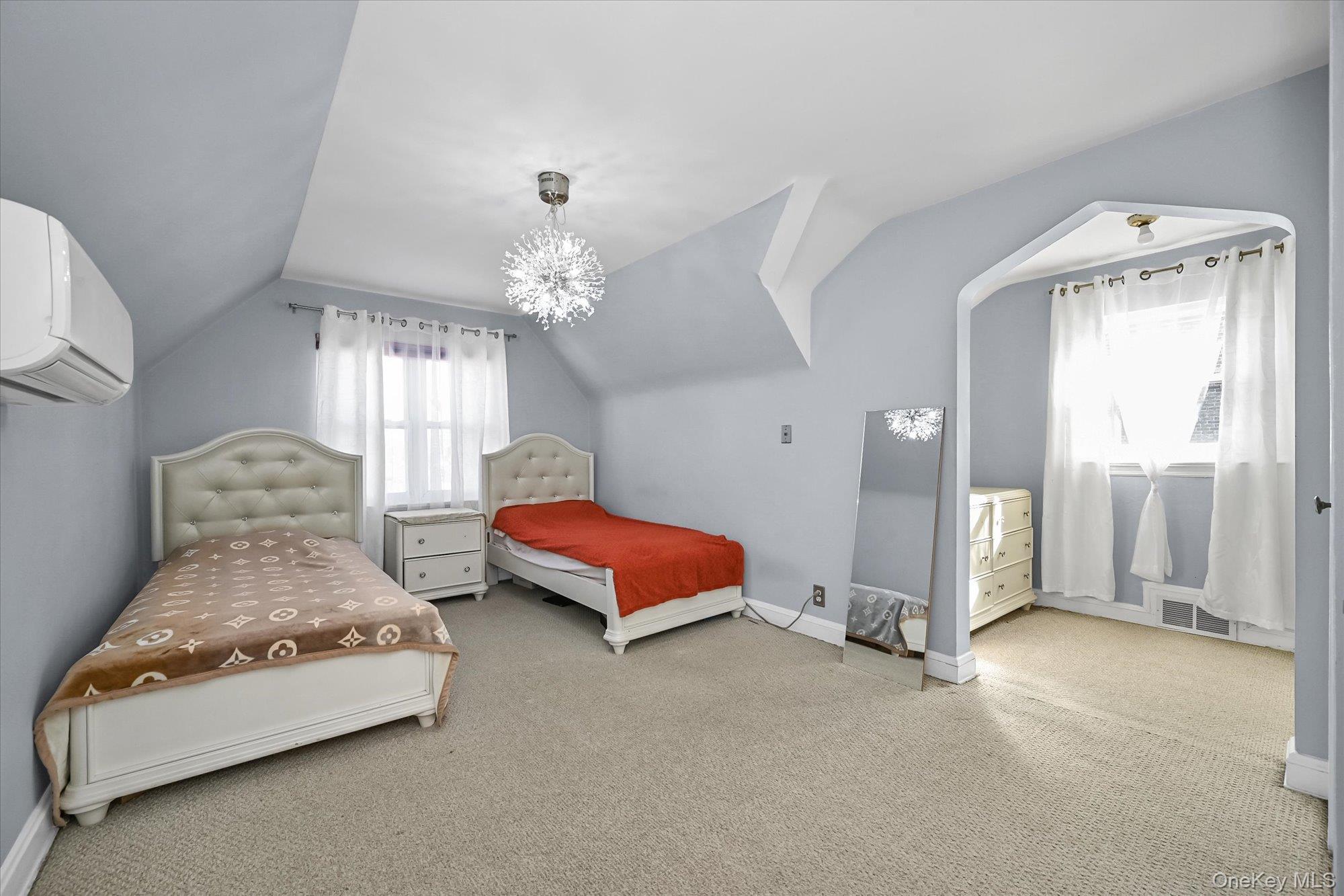 184-32 Cambridge Road Queens, NY 11432 - Photo 15 of 22 a spacious bedroom with two beds and window