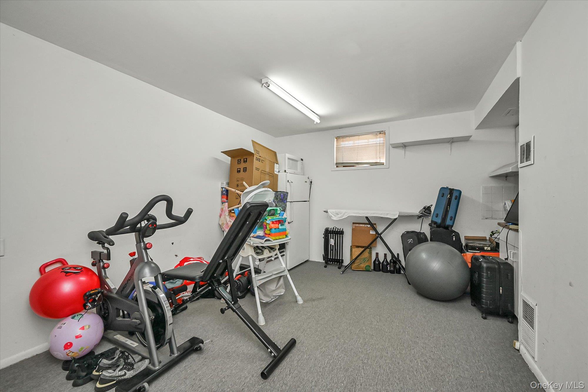 184-32 Cambridge Road Queens, NY 11432 - Photo 18 of 22 a view of a room with gym equipment