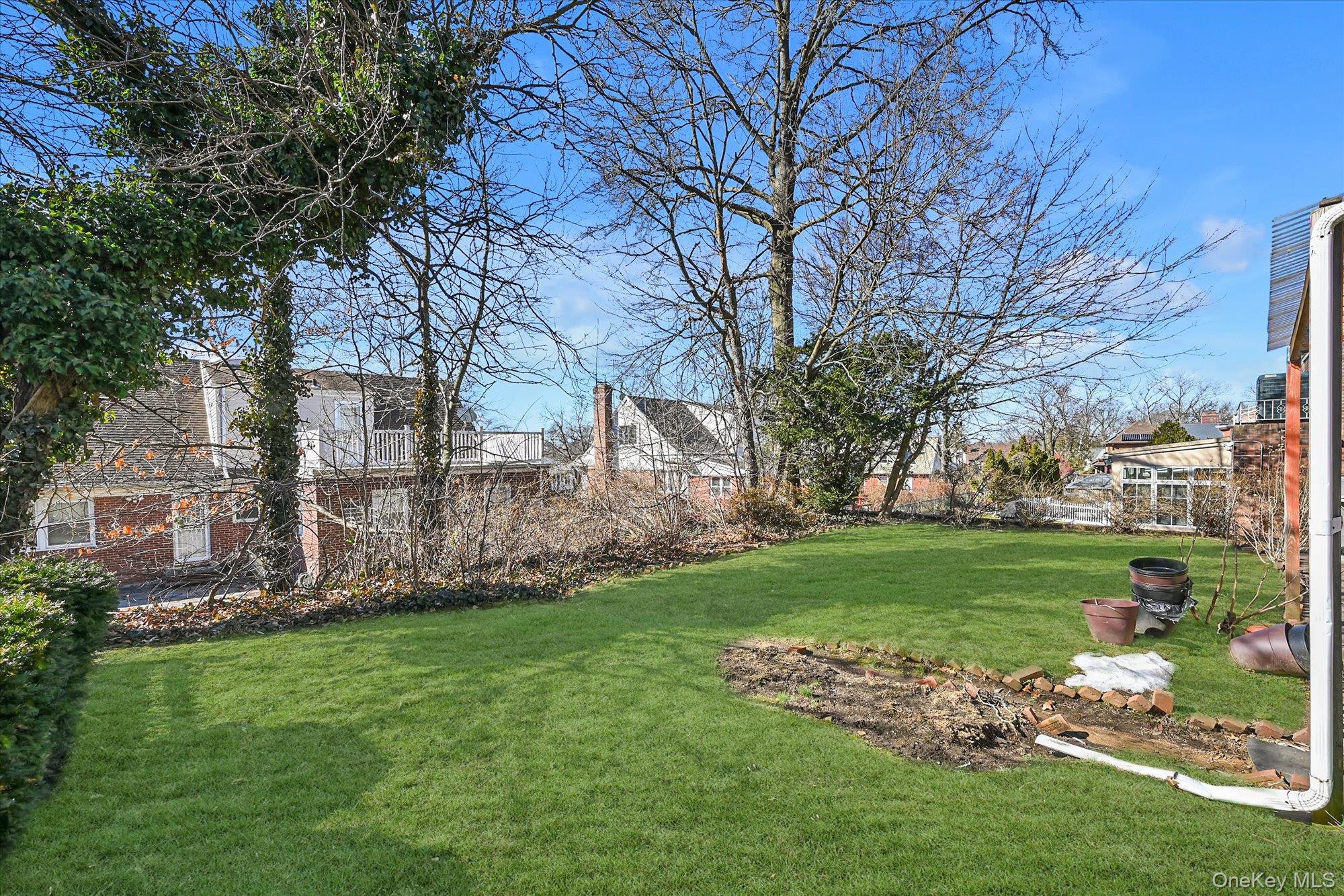 184-32 Cambridge Road Queens, NY 11432 - Photo 22 of 22 a view of a backyard with large trees