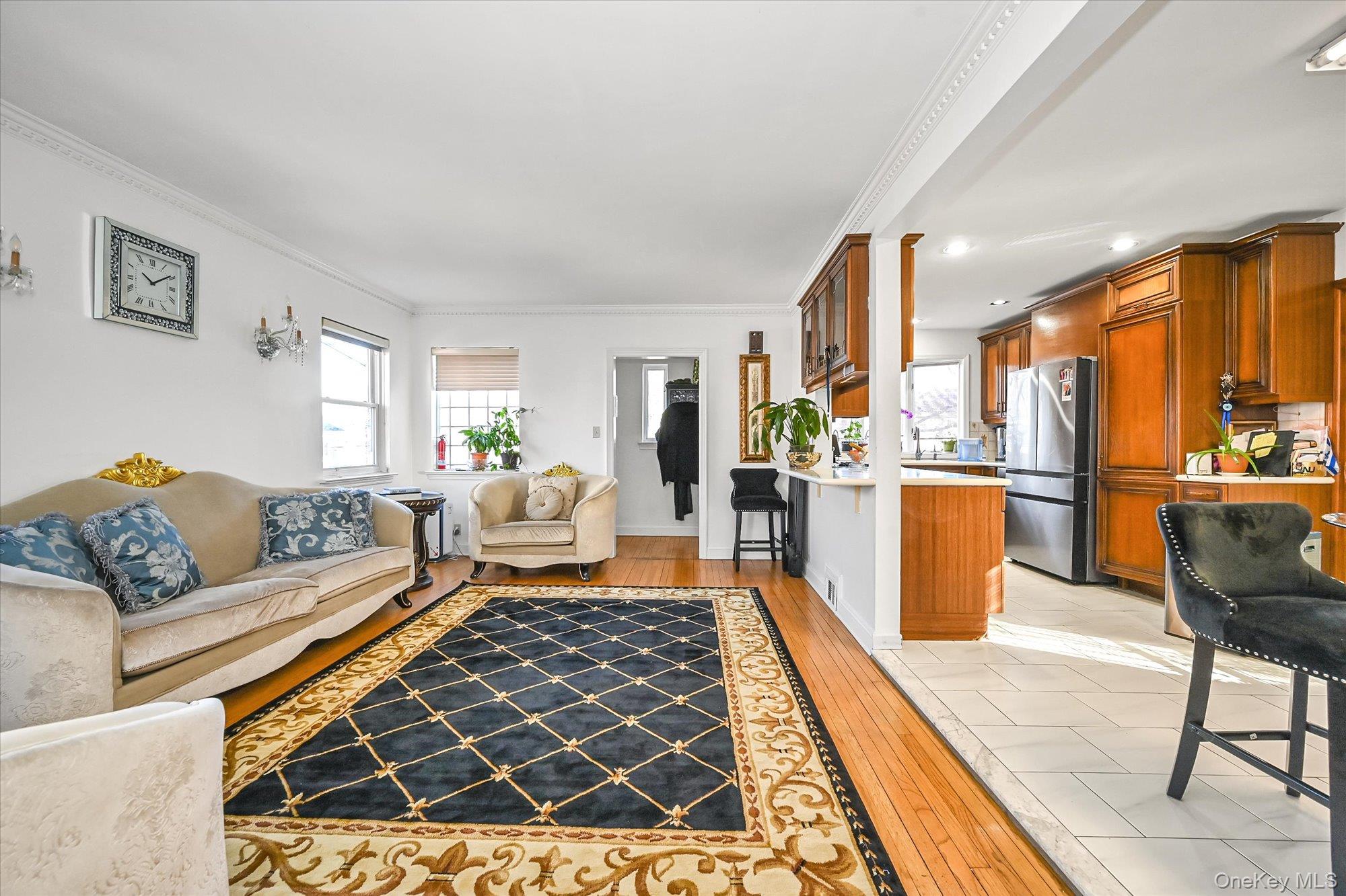 184-32 Cambridge Road Queens, NY 11432 - Photo 4 of 22 a living room with furniture and a rug