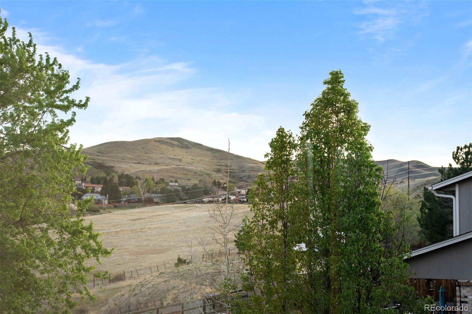 210 South Deframe Way Golden, CO 80401 - Photo 24 of 50 a view of a lake with a mountain in the background
