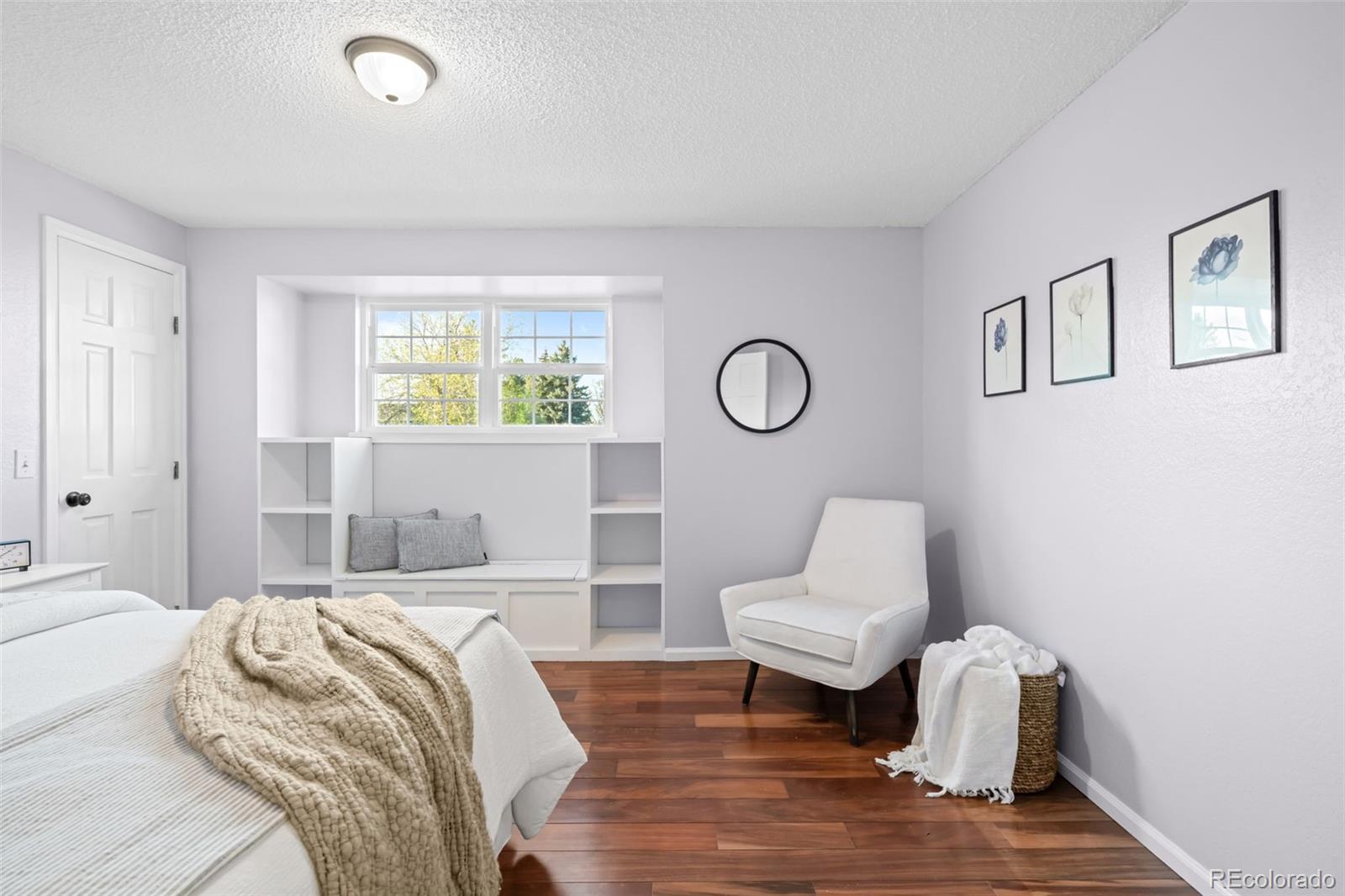 210 South Deframe Way Golden, CO 80401 - Photo 27 of 50 a bedroom with a bed and chair