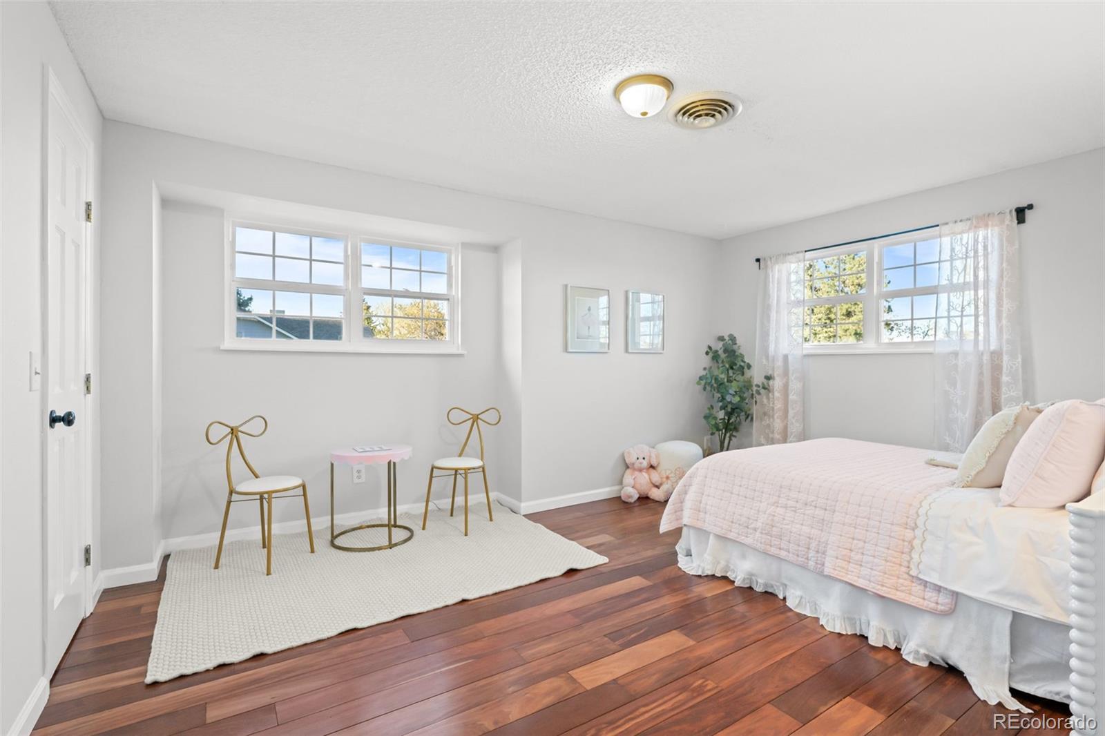 210 South Deframe Way Golden, CO 80401 - Photo 28 of 50 a bedroom with two beds and a potted plant