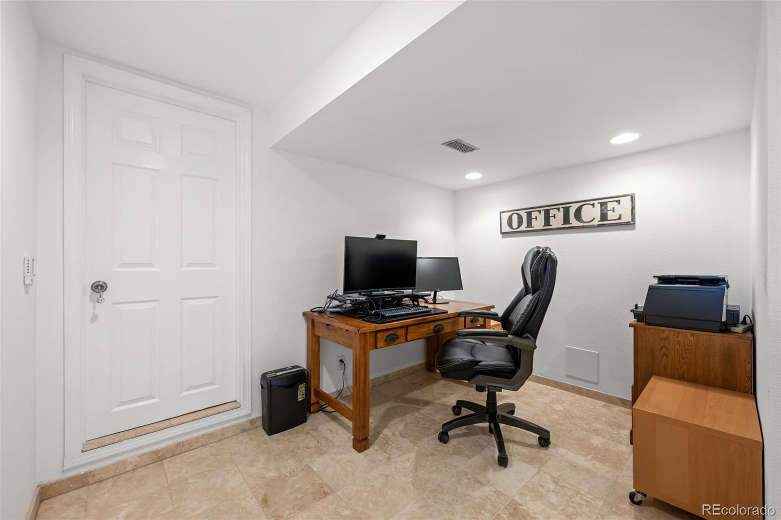 210 South Deframe Way Golden, CO 80401 - Photo 36 of 50 a view of a workspace with furniture and a window