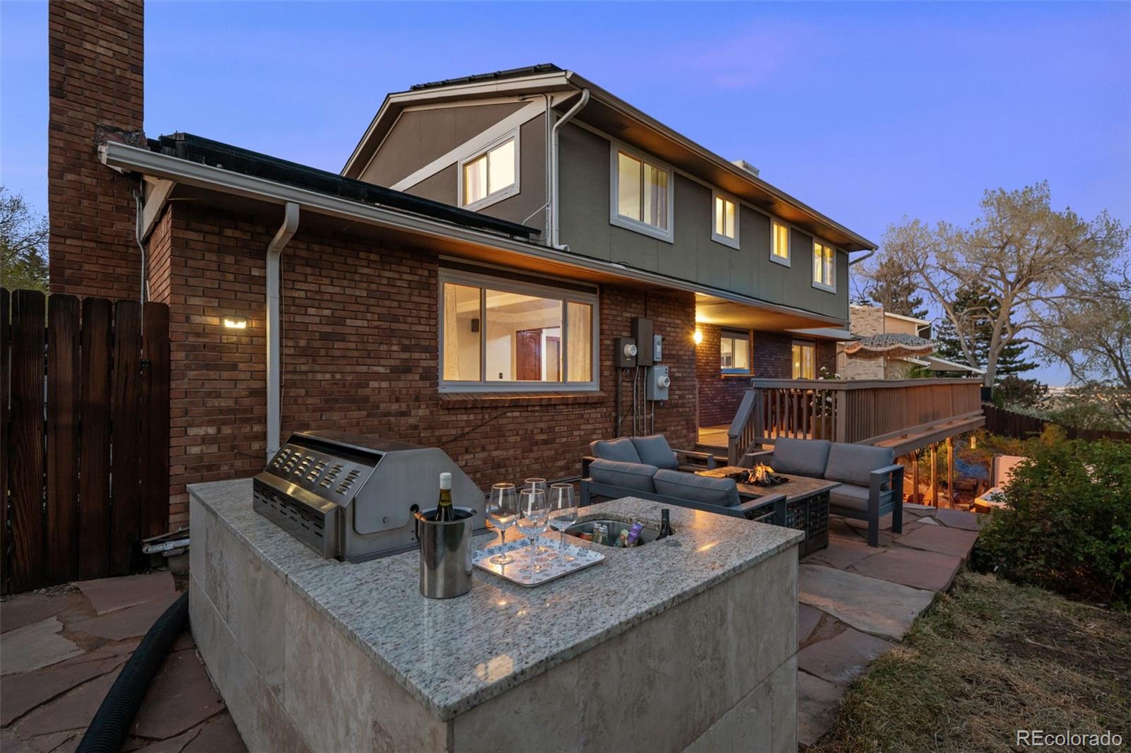 210 South Deframe Way Golden, CO 80401 - Photo 41 of 50 a view of the couches and dinning table and chairs in patio