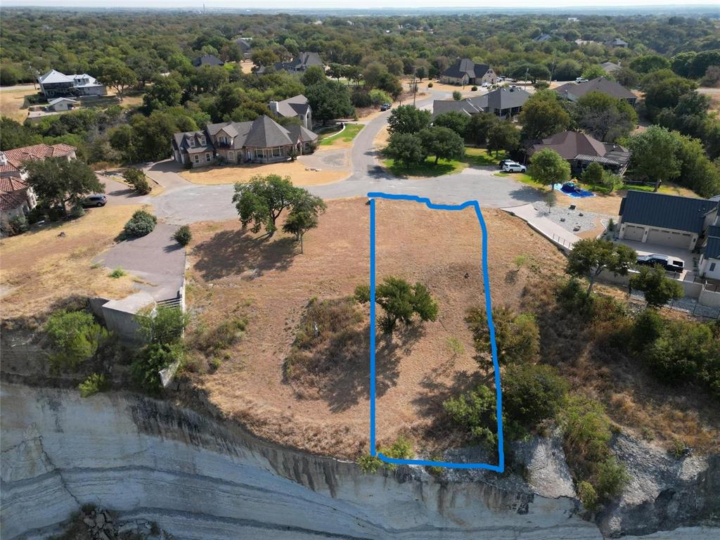1233 Overlook Court Whitney, TX 76692 - Photo 2 of 34 an aerial view of residential houses with outdoor space