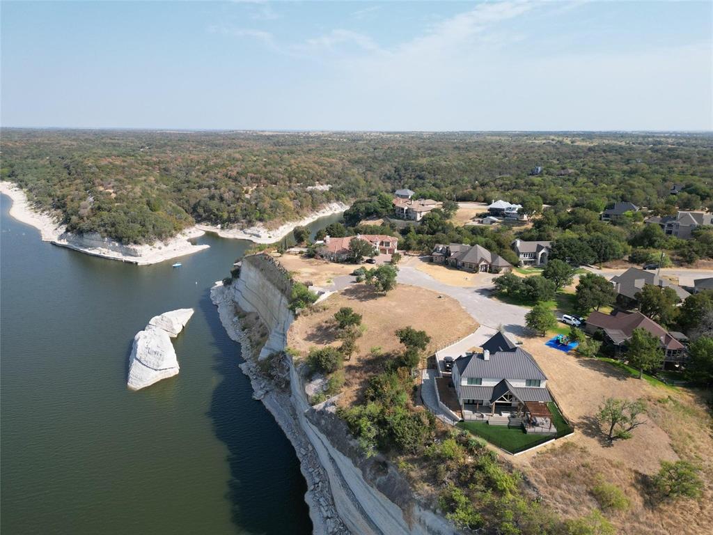 1233 Overlook Court Whitney, TX 76692 - Photo 24 of 34 an aerial view of a house with a swimming pool