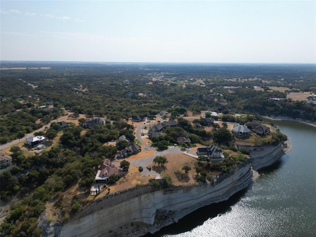 1233 Overlook Court Whitney, TX 76692 - Photo 25 of 34 an aerial view of residential house and car parked