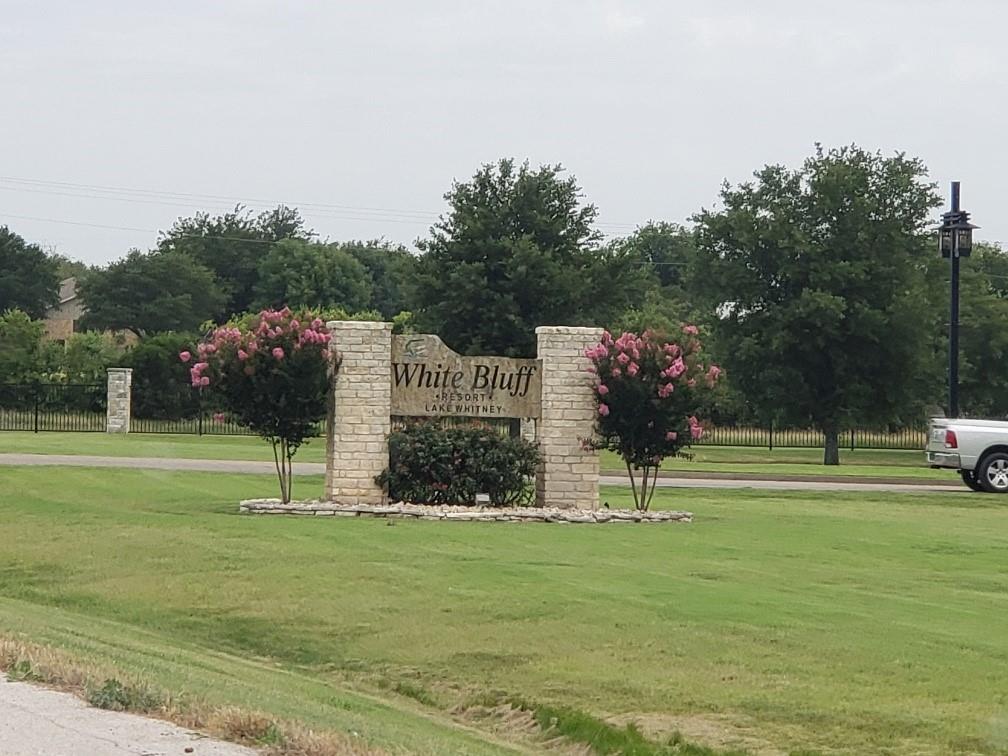 1233 Overlook Court Whitney, TX 76692 - Photo 28 of 34 a view of building with yard