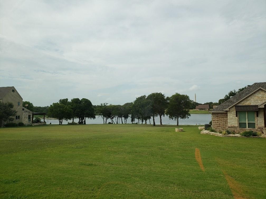 1233 Overlook Court Whitney, TX 76692 - Photo 32 of 34 a view of swimming pool and lake view