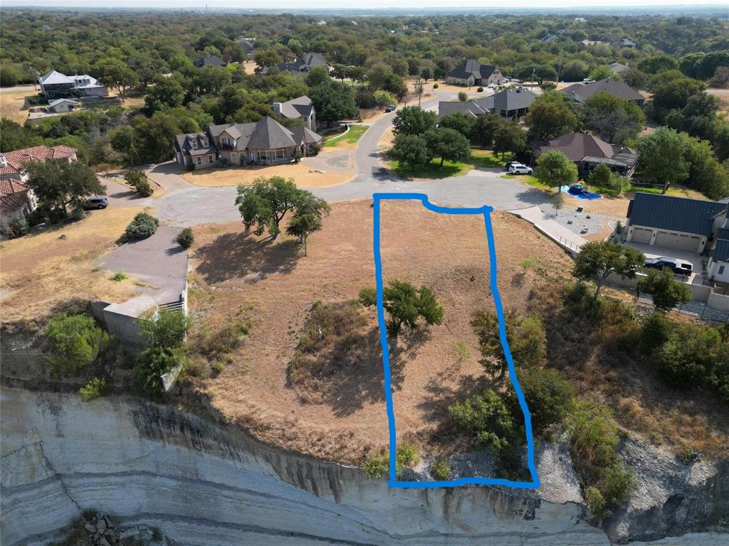 1233 Overlook Court Whitney, TX 76692 - Photo 34 of 34 an aerial view of a house with a yard lake view and mountain view in back