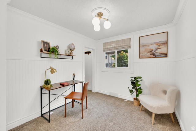 446 South 300 East Provo, UT 84606 - Photo 18 of 32 Carpeted room featuring white walls with wainscoting, crown molding, and a central ceiling light fixture