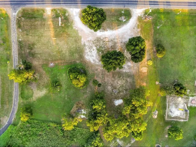 an aerial view of a house with swimming pool