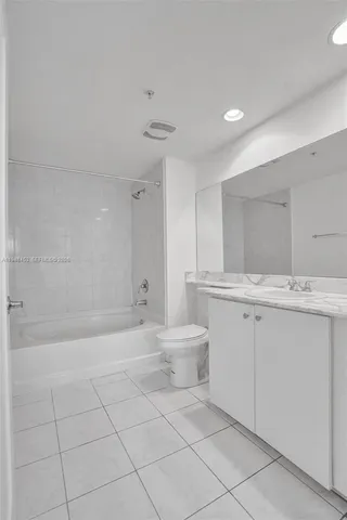 a bathroom with a sink a toilet and a bathtub