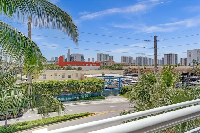 a view of a potted plants on the side of the road