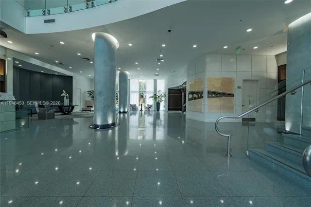 a lobby with a water view and living room view