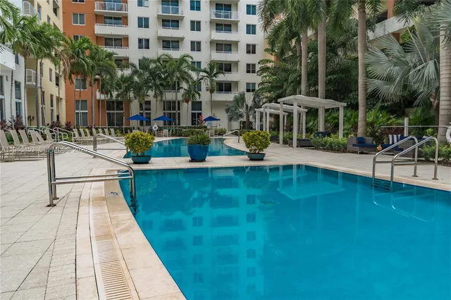 a view of swimming pool with outdoor seating