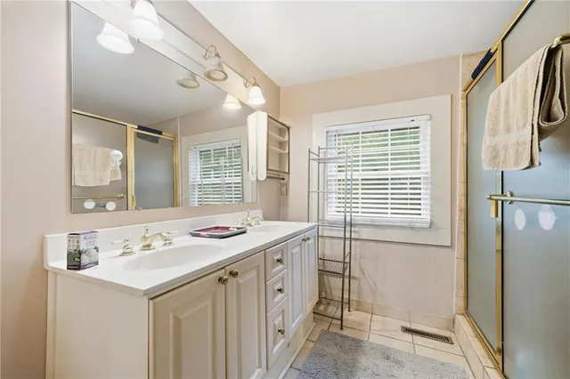 a bathroom with a sink a vanity and a mirror