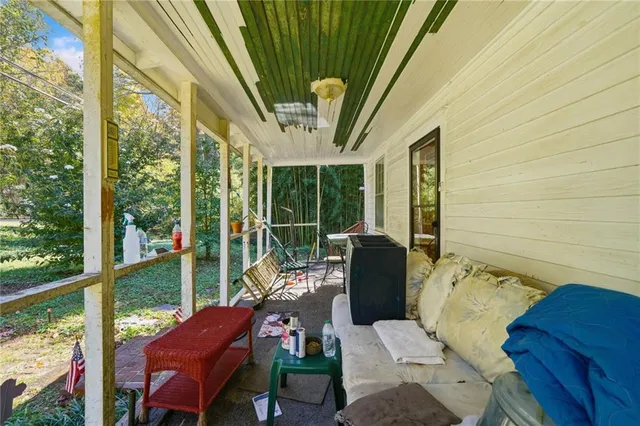a view of a small house with roof deck