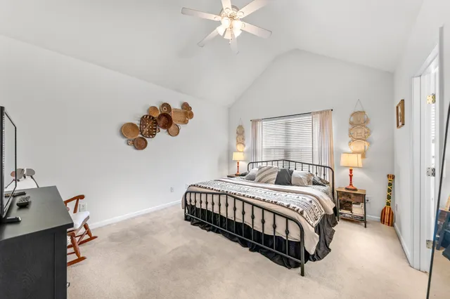 a bedroom with furniture and a wooden floor
