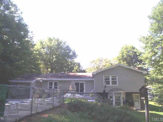 5412 Live Oak Trail Raleigh, NC 27613 - Photo 2 of 10 a front view of a house with yard and trees