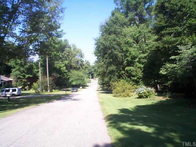 5412 Live Oak Trail Raleigh, NC 27613 - Photo 3 of 10 a view of a road with a yard